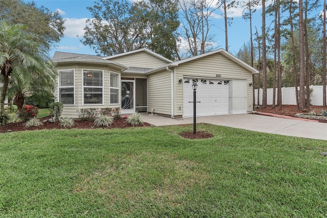 ranch-style home with an attached garage, a front yard, and fence