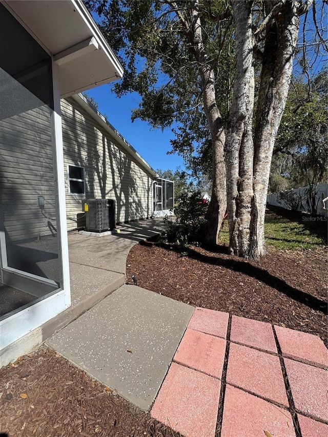 view of yard with a patio area and central AC unit