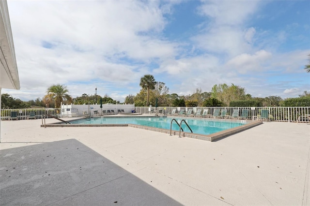 pool featuring a patio and fence