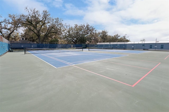 view of sport court with fence