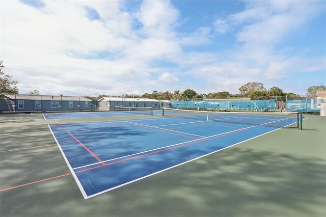 view of tennis court with fence