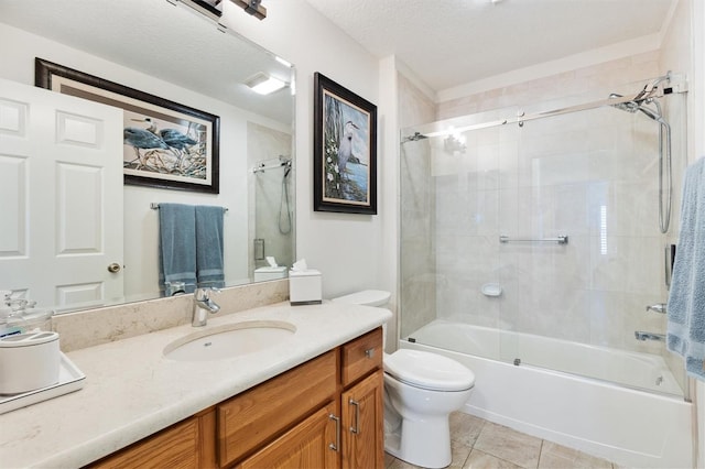 bathroom featuring bath / shower combo with glass door, toilet, tile patterned flooring, a textured ceiling, and vanity