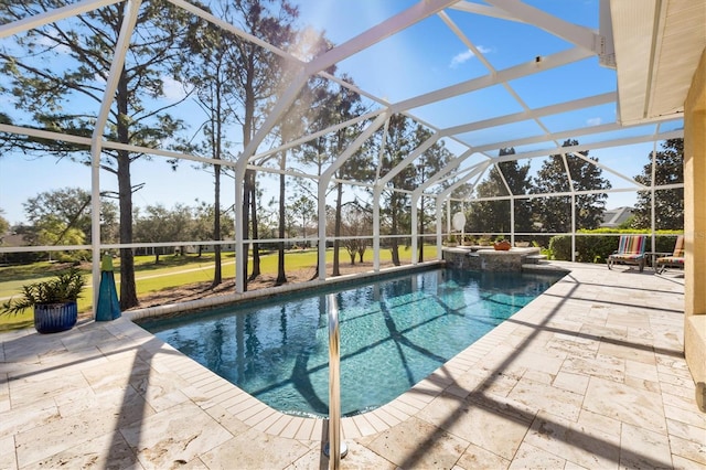 view of swimming pool with glass enclosure, a patio area, and a pool with connected hot tub