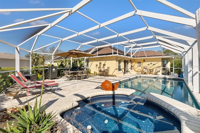 view of pool featuring outdoor dining space, a patio area, a lanai, and a pool with connected hot tub