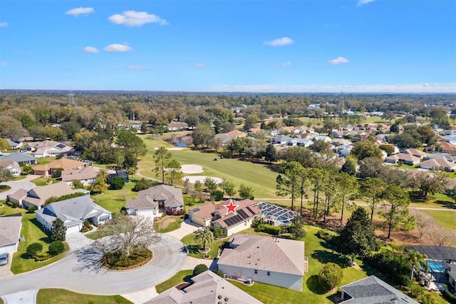 drone / aerial view with a residential view and view of golf course