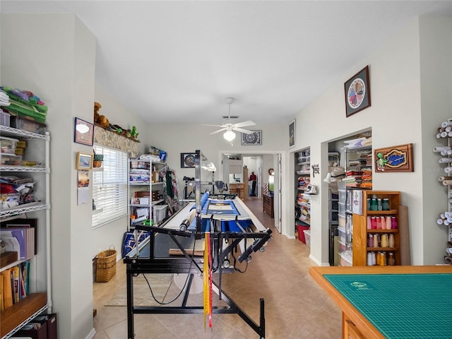 game room with tile patterned flooring and a ceiling fan