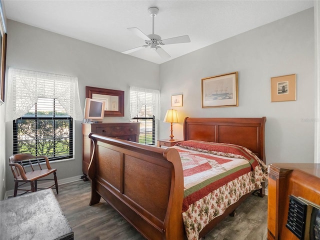 bedroom featuring dark wood-type flooring and baseboards