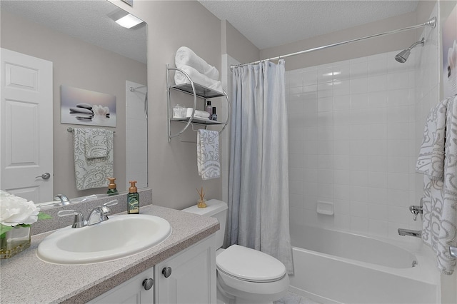 full bath featuring shower / tub combo, toilet, vanity, and a textured ceiling