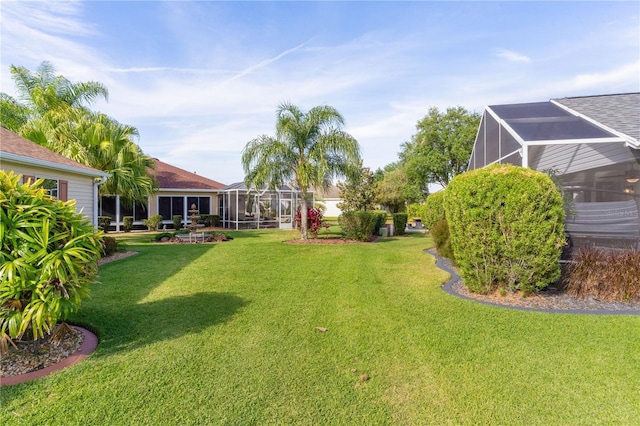 view of yard featuring a lanai