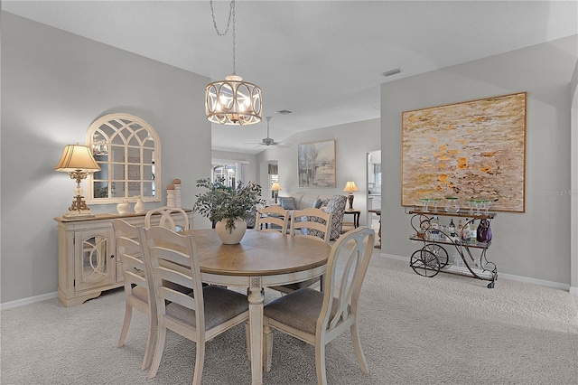 dining area with visible vents, baseboards, and light colored carpet