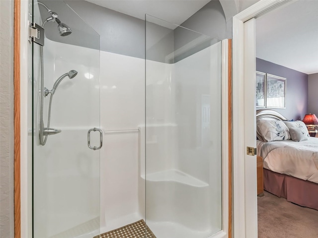 full bathroom with a shower stall and ensuite bath