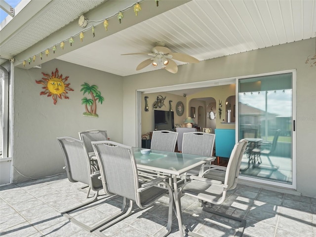 view of patio featuring a ceiling fan and outdoor dining space