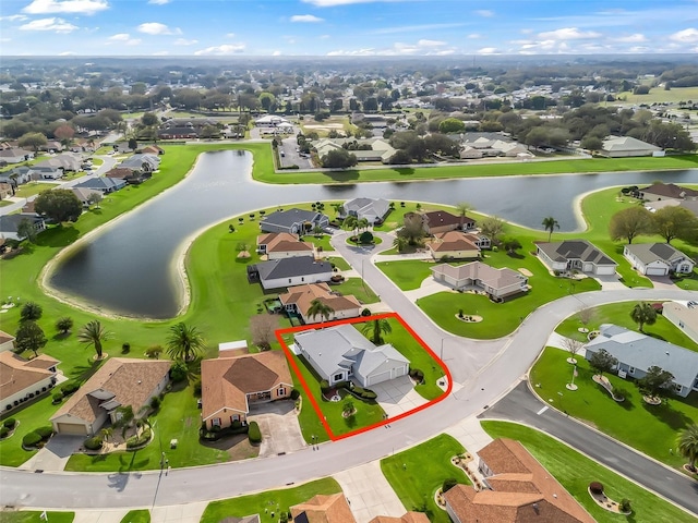 bird's eye view featuring a water view and a residential view