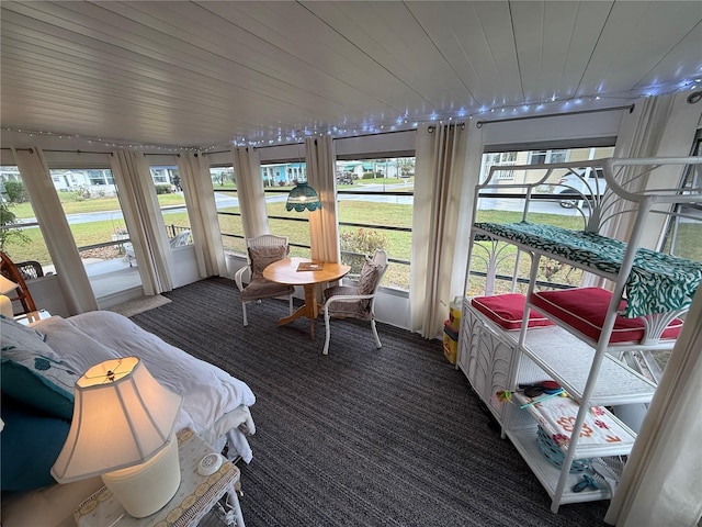 sunroom / solarium featuring wood ceiling