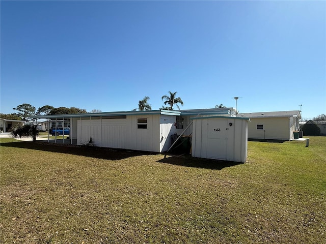 back of property with a lawn