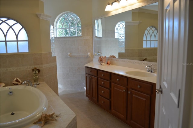 bathroom with a wealth of natural light, tile walls, and vanity