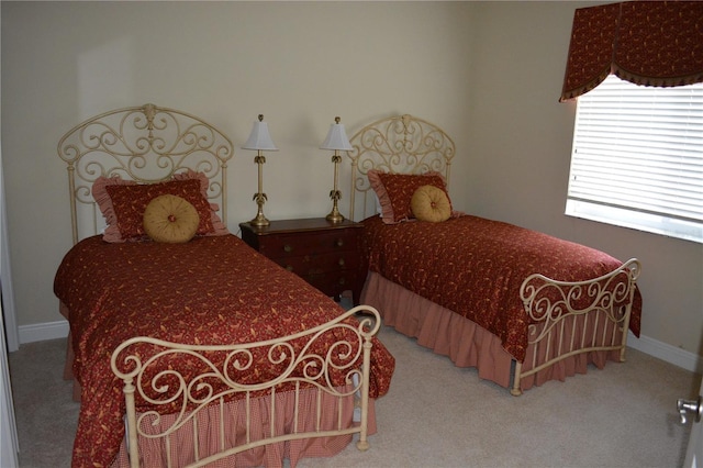 carpeted bedroom with baseboards