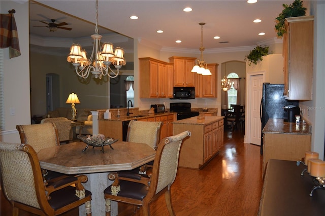 dining room with arched walkways, wood finished floors, and ornamental molding