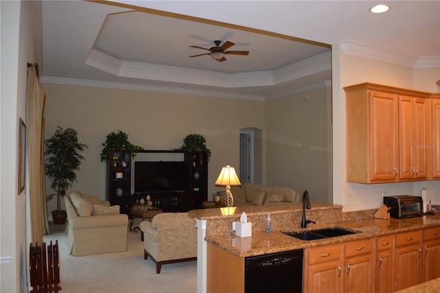 kitchen featuring a sink, black dishwasher, open floor plan, light stone countertops, and ceiling fan