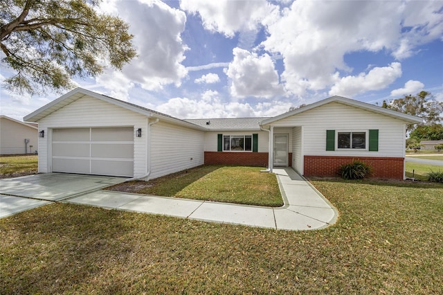 ranch-style home featuring a garage, driveway, brick siding, and a front lawn