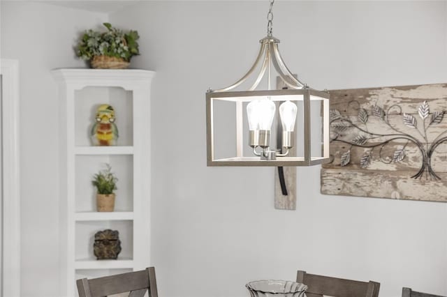 room details with built in shelves and a notable chandelier