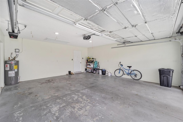 garage with water heater and a garage door opener