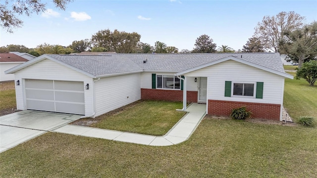 ranch-style house with a front yard, brick siding, and an attached garage