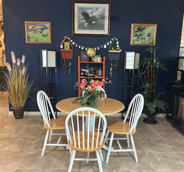 dining space with baseboards