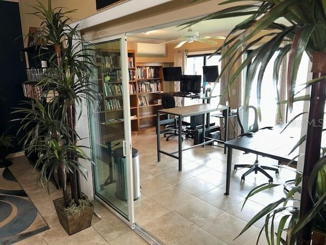 home office featuring light tile patterned floors and a wall mounted AC