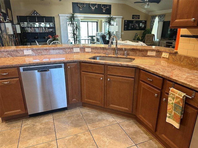 kitchen with light tile patterned flooring, a sink, dishwasher, brown cabinetry, and crown molding