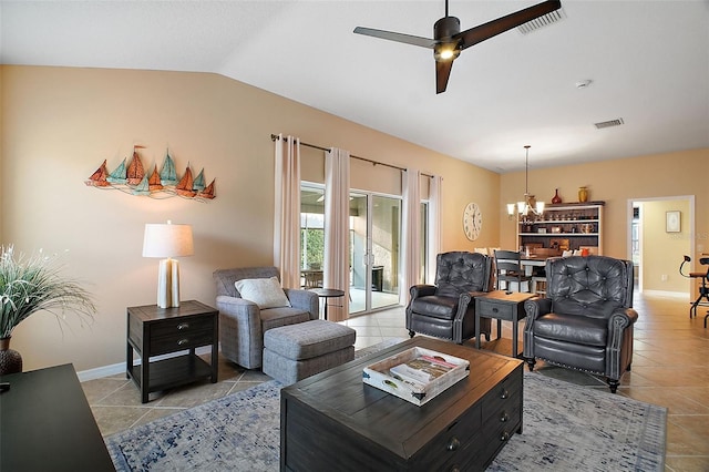 living area with light tile patterned floors, visible vents, vaulted ceiling, and ceiling fan with notable chandelier