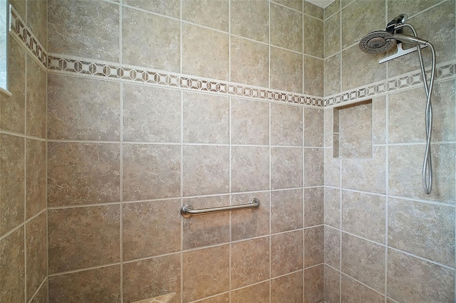 full bathroom with tiled shower