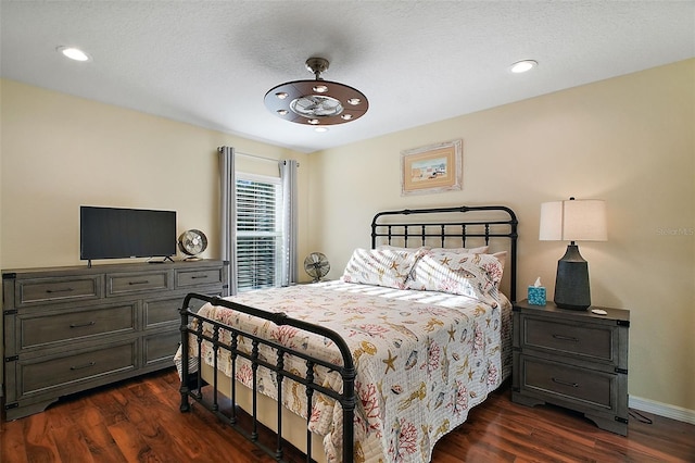 bedroom with baseboards, dark wood-style flooring, and recessed lighting