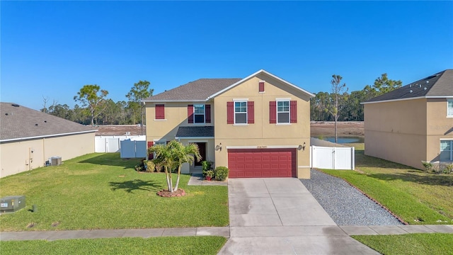 view of front of property featuring a gate, driveway, fence, and stucco siding