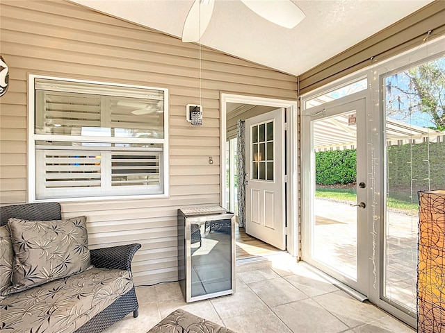 sunroom / solarium featuring vaulted ceiling