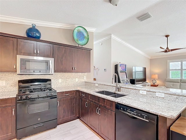 kitchen featuring a peninsula, a sink, ornamental molding, decorative backsplash, and black appliances