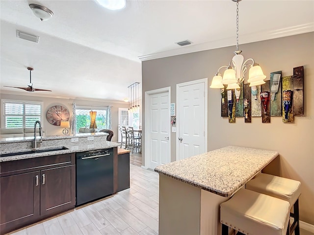 kitchen with dark brown cabinetry, visible vents, dishwasher, a kitchen breakfast bar, and a sink