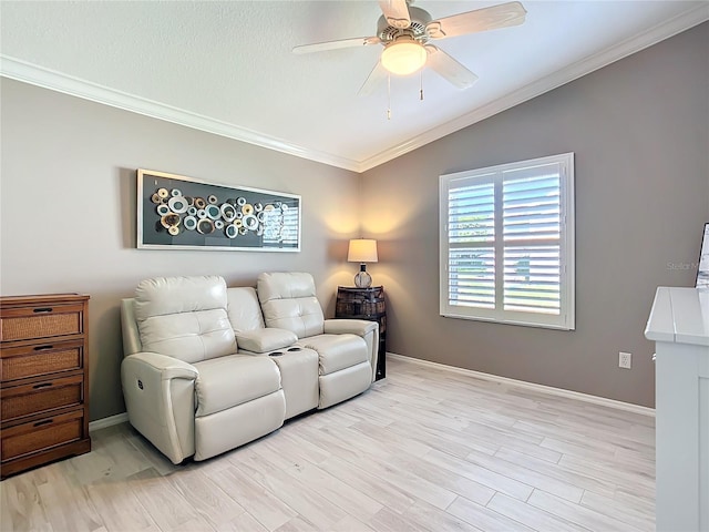 living area with light wood finished floors, ceiling fan, ornamental molding, and vaulted ceiling