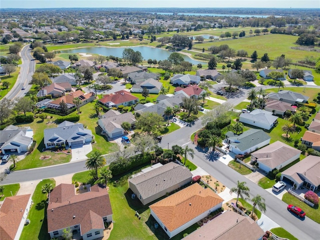 bird's eye view featuring a residential view and a water view