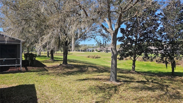 view of yard with a sunroom