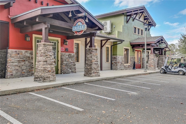 view of property featuring uncovered parking