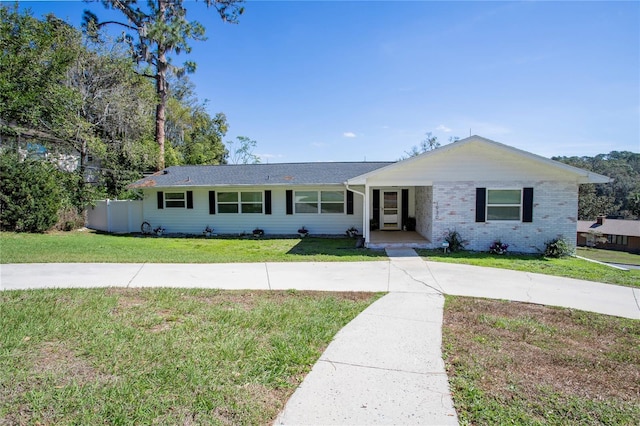 1930 Hilltop Dr, Mount Dora, FL 32757 - single story home with brick siding and a front lawn