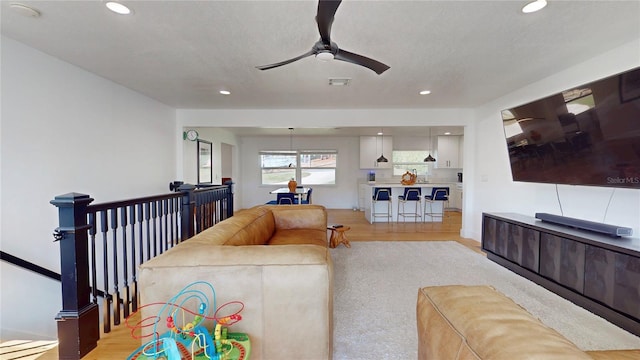 1930 Hilltop Dr, Mount Dora, FL 32757 - living room featuring light wood finished floors, recessed lighting, visible vents, and a ceiling fan