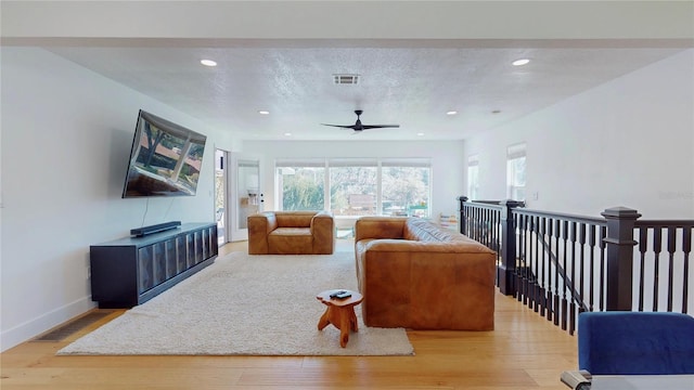 1930 Hilltop Dr, Mount Dora, FL 32757 - living area featuring recessed lighting, visible vents, a textured ceiling, wood finished floors, and baseboards