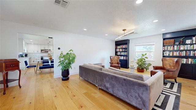 1930 Hilltop Dr, Mount Dora, FL 32757 - living area featuring light wood finished floors, baseboards, visible vents, and recessed lighting