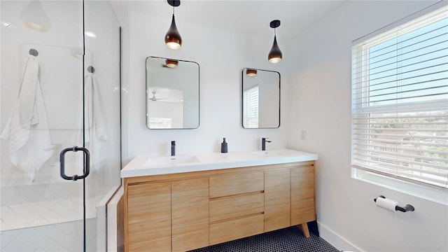 1930 Hilltop Dr, Mount Dora, FL 32757 - bathroom with a sink, a shower stall, baseboards, and double vanity