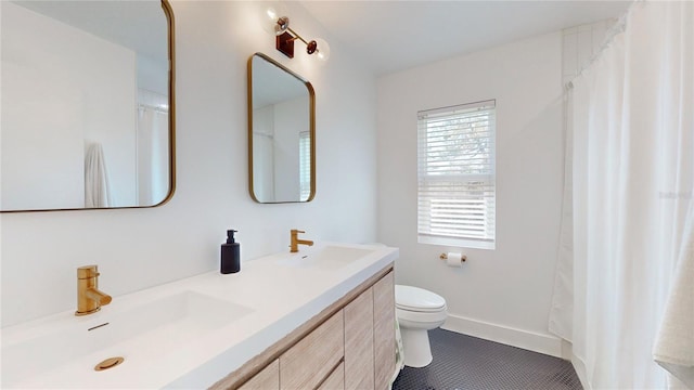 1930 Hilltop Dr, Mount Dora, FL 32757 - bathroom with double vanity, a sink, toilet, and tile patterned floors
