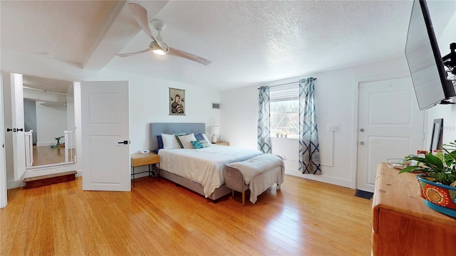1930 Hilltop Dr, Mount Dora, FL 32757 - bedroom with a ceiling fan, light wood-type flooring, and a textured ceiling