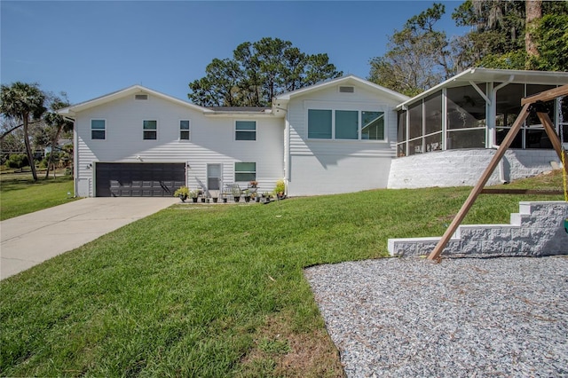 1930 Hilltop Dr, Mount Dora, FL 32757 - view of front facade featuring a garage, a front yard, a sunroom, and concrete driveway