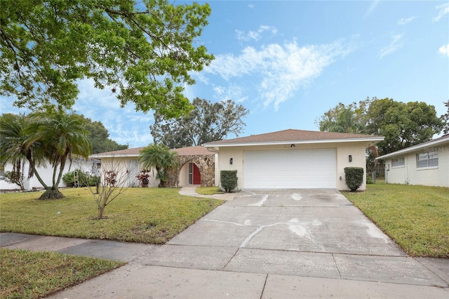 single story home featuring driveway, a front lawn, an attached garage, and stucco siding